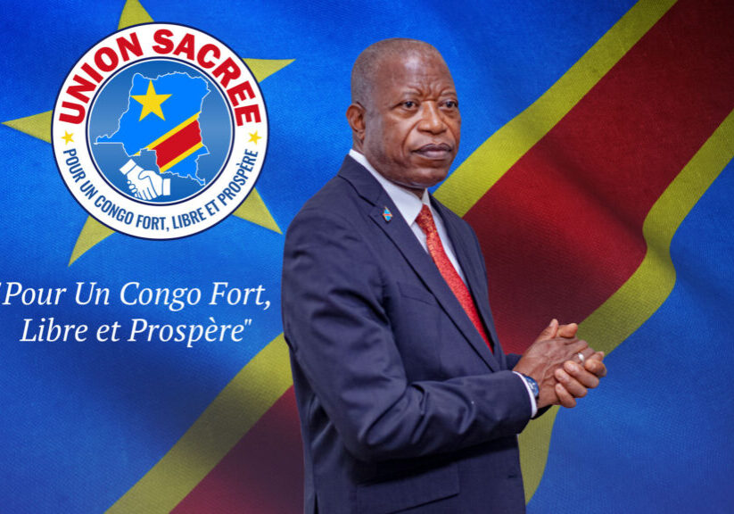 prof_andré_mbata,_secrétaire_permanent_de_l’union_sacrée_de_la_nation_debut_logo_slogan